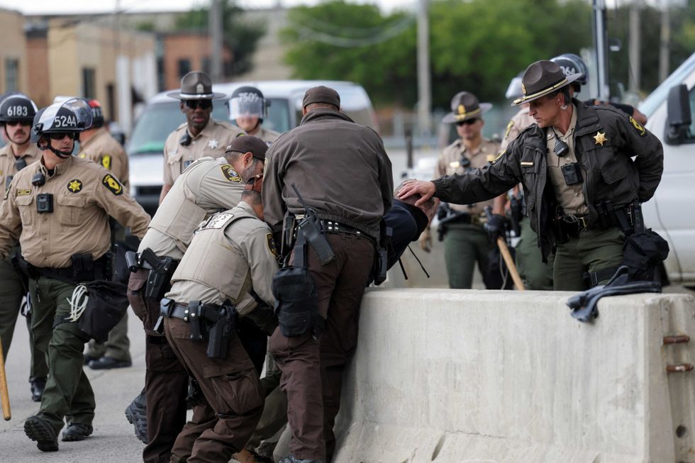 cook-county-sheriff-s-police-officers-detain-a-man-outside-the-u-s-immigration-and-customs-enforcement-ice-broadview-facilit