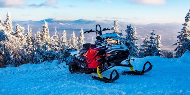 jan2019__mg_4524_snowmobile-on-mountain-top_kyle-haley-1-panorama-scaled-1