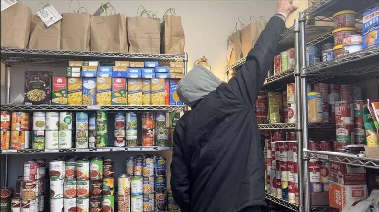 man-reaching-for-food-pantry